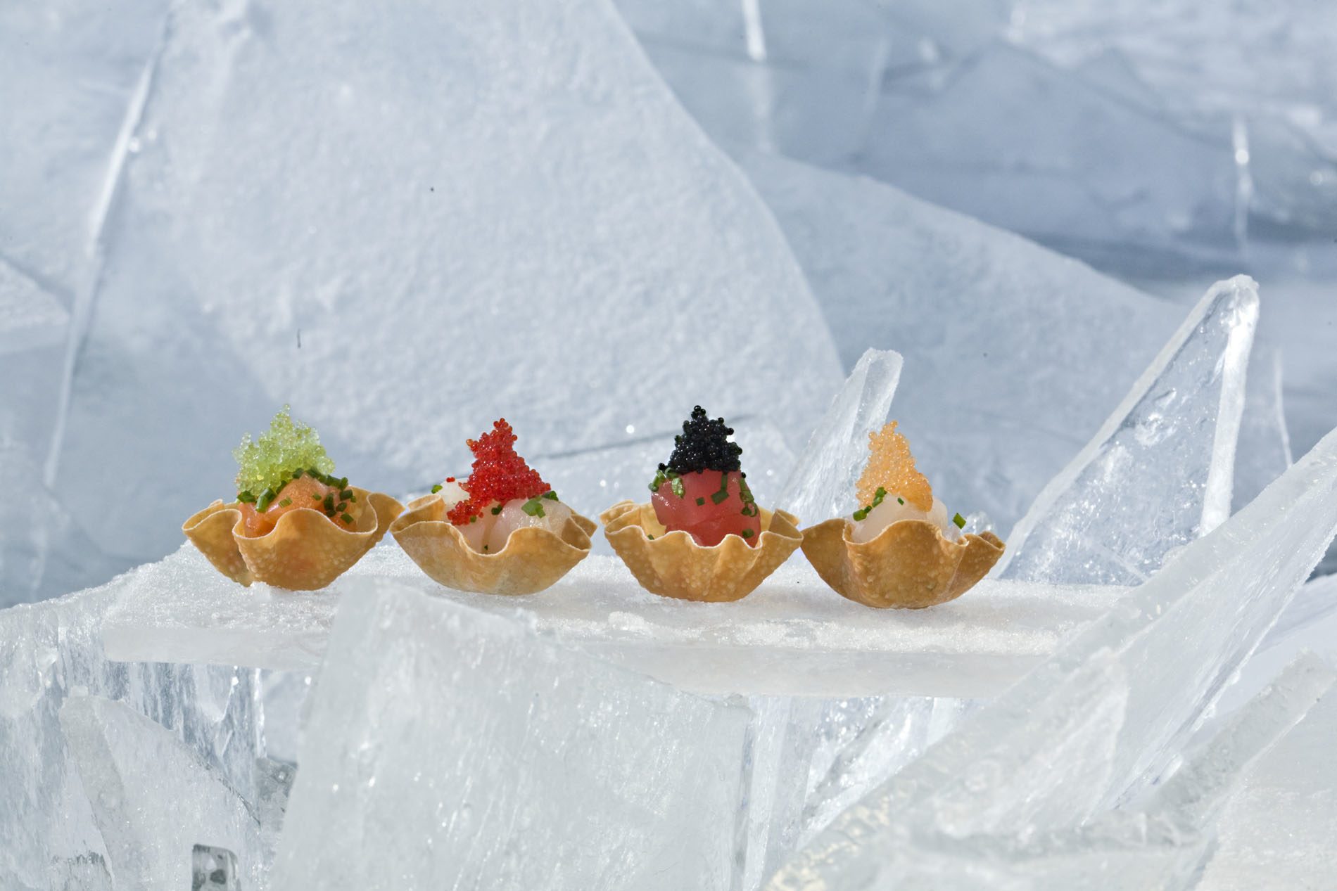 Sushi cups served on an ice sculpture