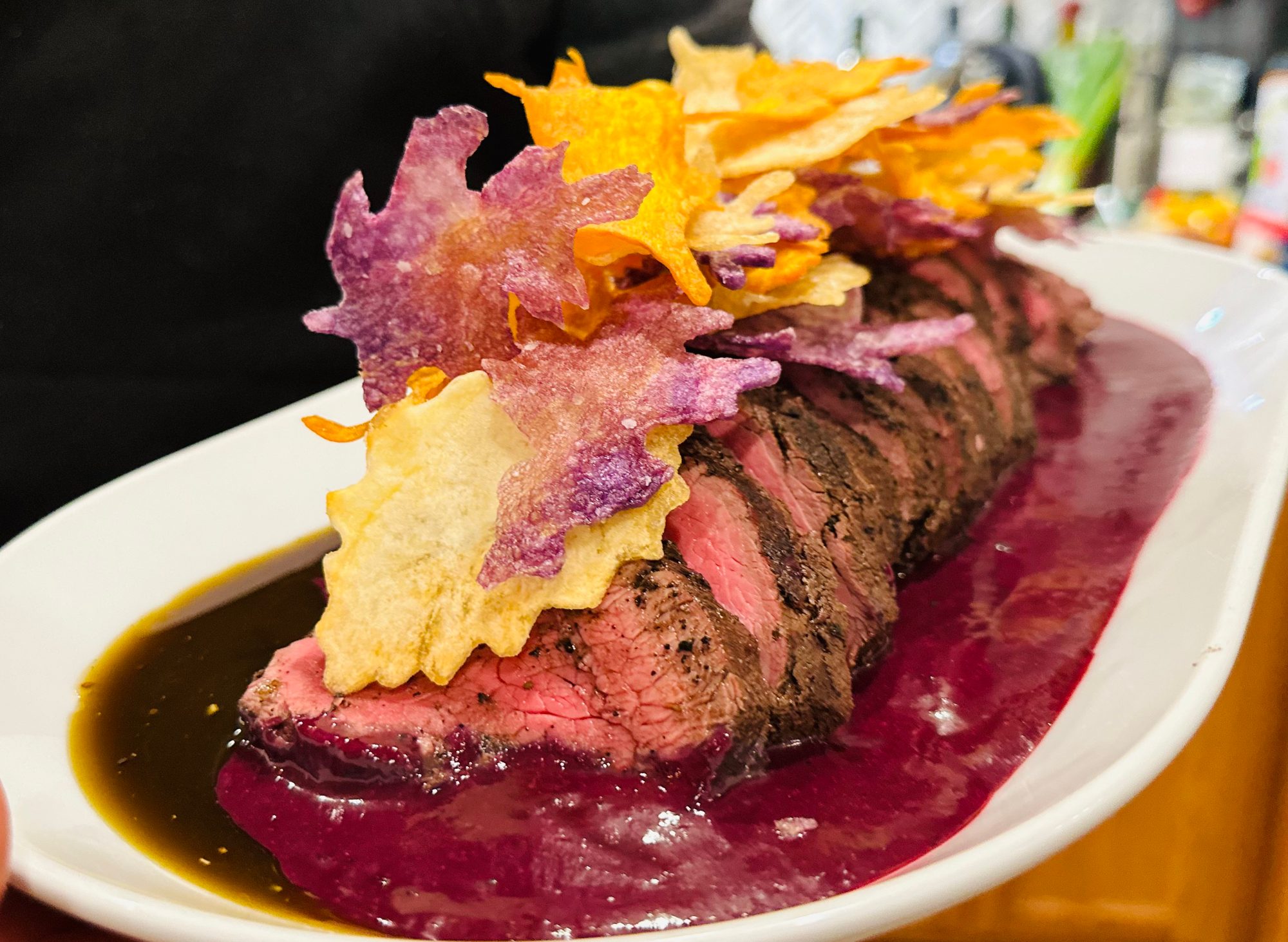 Beef tenderloin with purple and orange chips