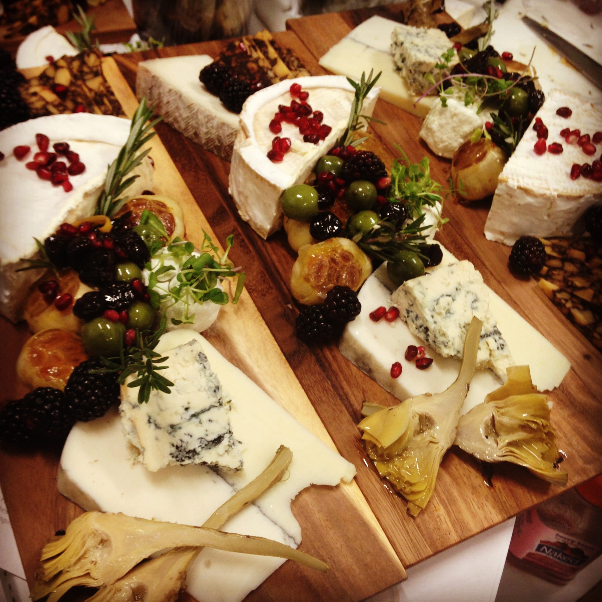 A cheese board with pomegranate