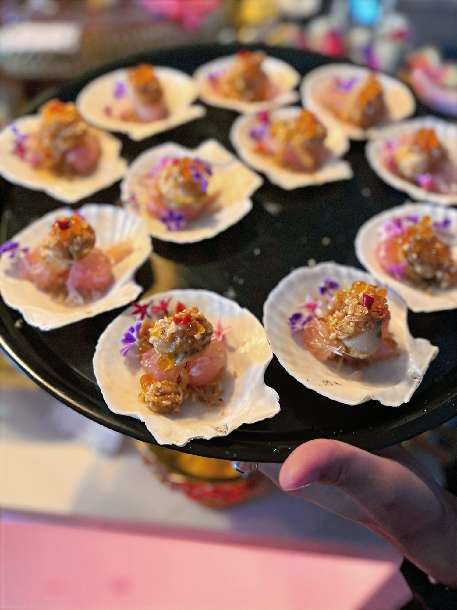 Crudo served in scallop shells