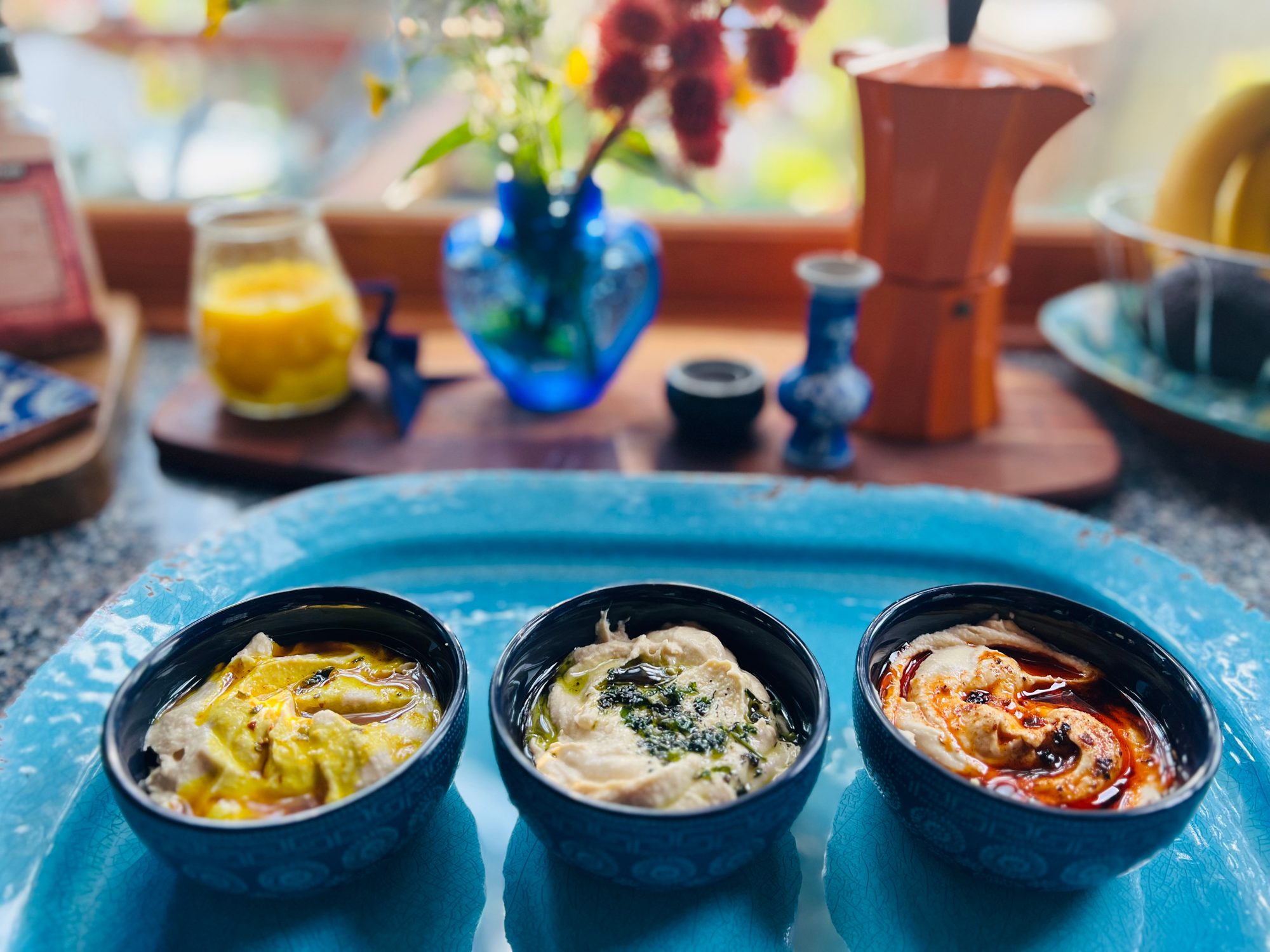 Three bowls on a turquoise tray
